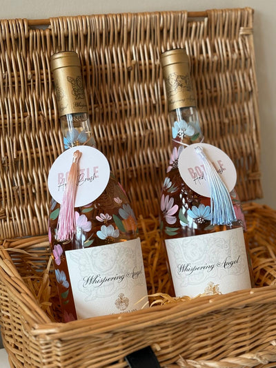 Hand painted bottle with pastel floral design for birthday gift personalised