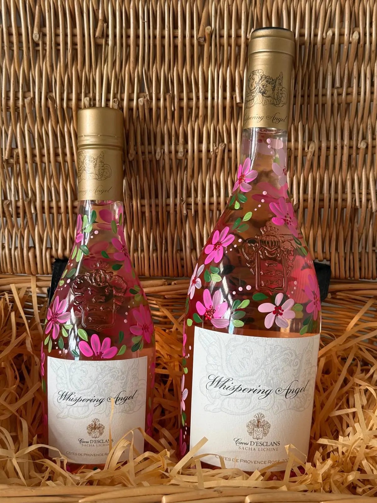 Two hand painted personalised bottles, mini and standard size